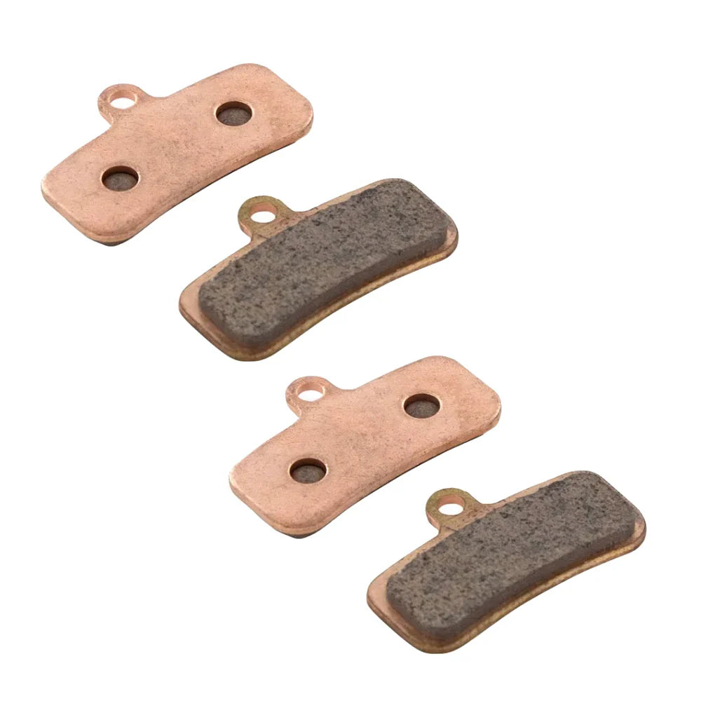 Set of four brake pads on a white background