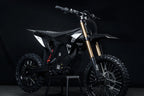 Black Delta dirt bike on a dark background