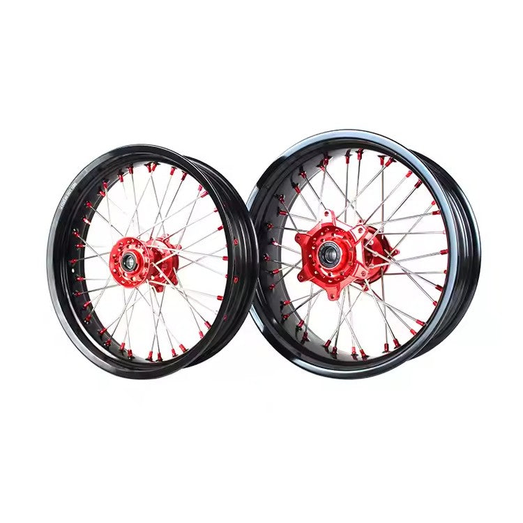 Pair of motorcycle wheels with red spokes on a white background