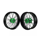 Two motorcycle wheels with green spoked hubs on a white background