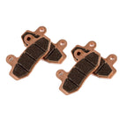 Two sets of brake pads on a white background