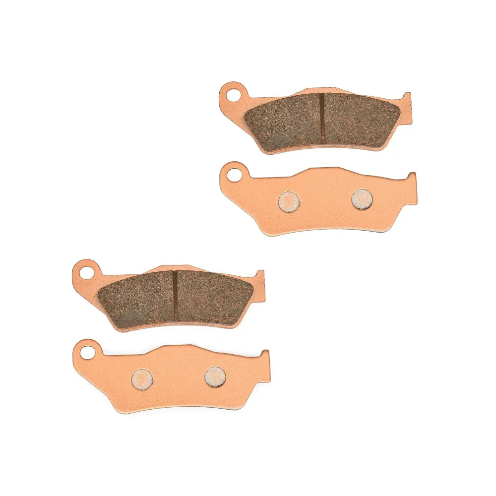 Set of four brake pads on a white background