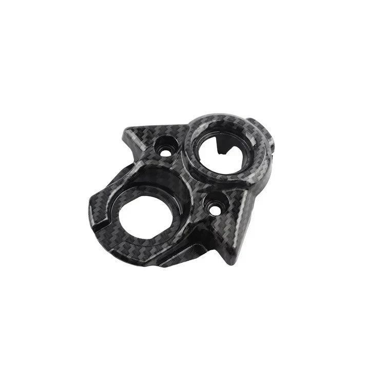 Carbon fiber ignition cover on a white background
