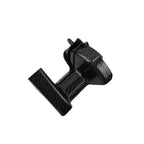 Black plastic component on a white background