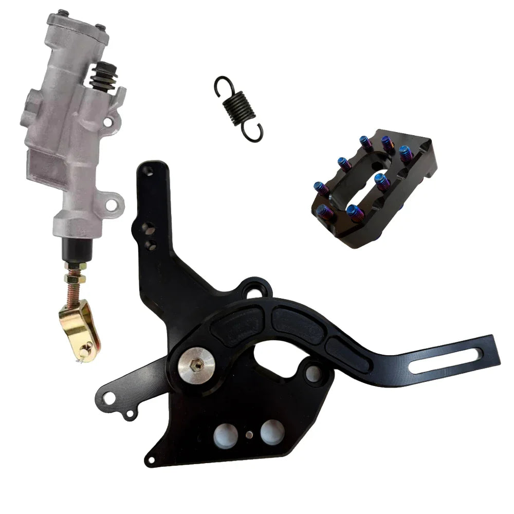 Mechanical parts including a black metal bracket, a gray cylindrical component, and a small black block with blue and red elements on a white background.