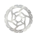 Metallic disc brake rotor on a white background