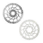 Two metallic bike disc rotors on a white background