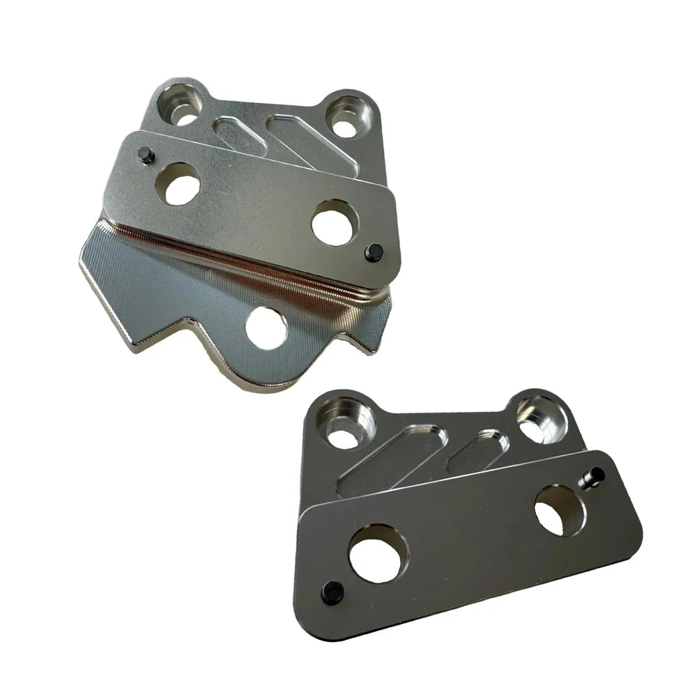 Two metallic brackets on a white background